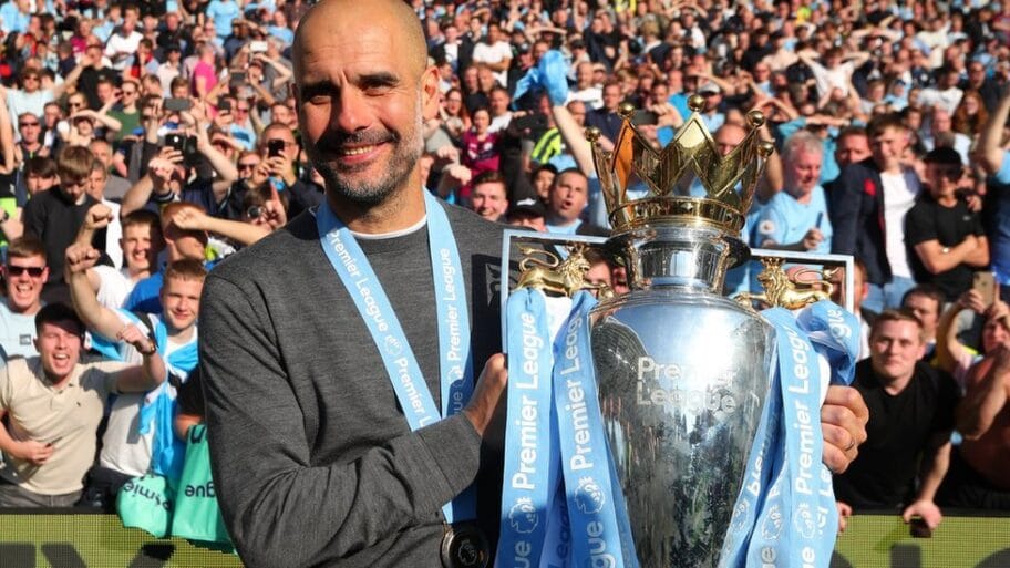 107007862 guardiola trophy getty2