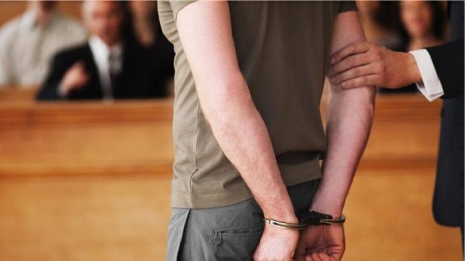 111805303 104597466 handcuffedmangetty