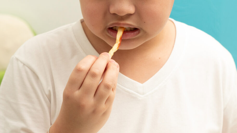 132776225 child eating fry getty